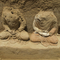 Fig. 30 - Zone 14: Buddhas no. 5 (to the left), and no. 4 (showing traces of restauration with red clay) 